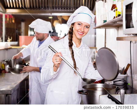 cooks cooking at professional kitchen cooks cooking at professional kitchen 17039833