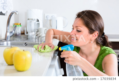 Woman doing chores in kitchen 17039834