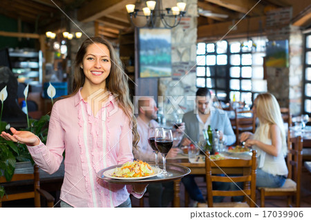 Adults having dinner and waiter 17039906