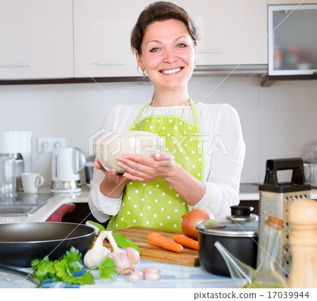 Woman cooking rice with vegetables 17039944