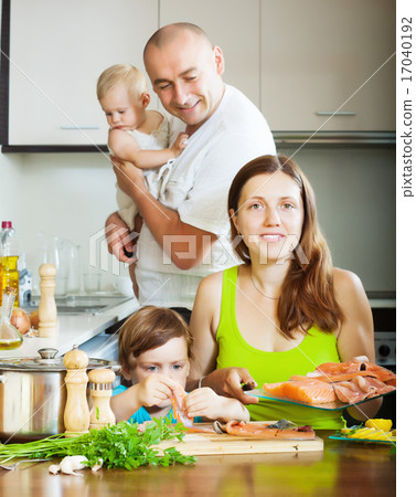 family of four cooking red fish family of four cooking red fish 17040192