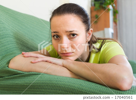 Sad woman sitting at home 17040561