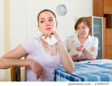 Women reading documents at table 17040747