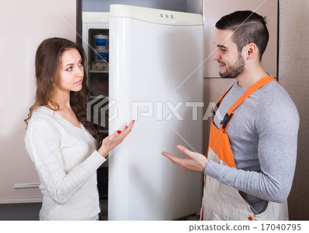 Client and repairman near fridge Client and repairman near fridge 17040795