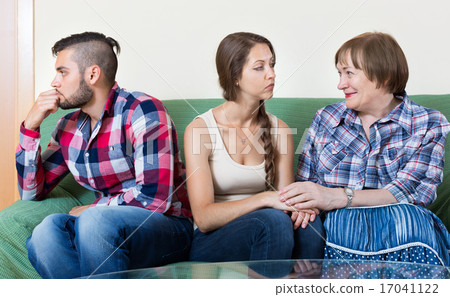 Mature woman comforts sad daughter 17041122