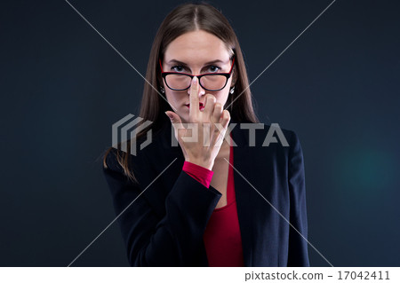 Photo of woman fixing glasses Photo of woman fixing glasses 17042411