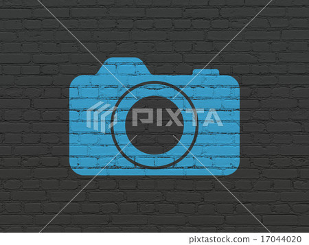Vacation concept: Photo Camera on wall background Vacation concept: Photo Camera on wall background 17044020