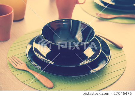 Close up modern classic dining set on wooden dining table Close up modern classic dining set on wooden dining table 17046476