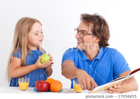 Father and daughter sitting at the table Father and daughter sitting at the table 17056655