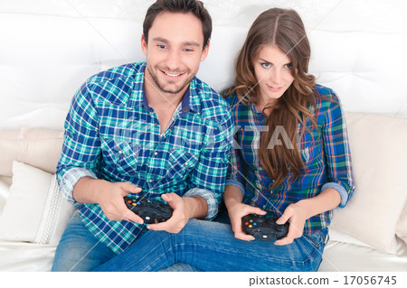 Pleasant couple playing video games Pleasant couple playing video games 17056745
