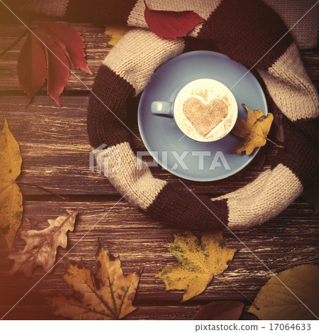 Autumn leafs, scarf and coffee cup on wooden table. Autumn leafs, scarf and coffee cup on wooden table. 17064633
