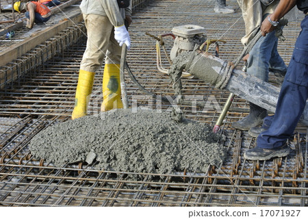 Construction Workers Using Concrete Hose  17071927