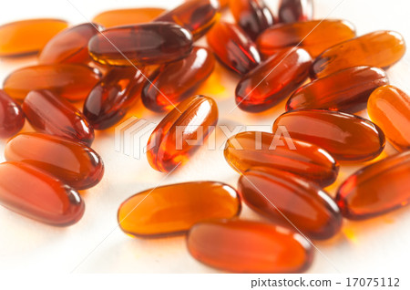 Vitamin in capsule on white Vitamin in capsule on white 17075112