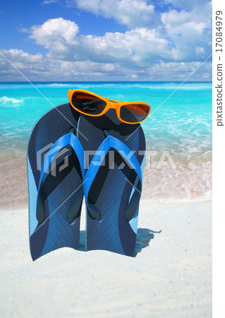 Blue flip flops and sunglasses 17084979