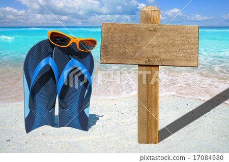 Blue flip flops and wooden signboard 17084980