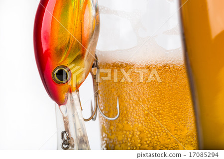 fishing bait wobblers near glass with beer fishing bait wobblers near glass with beer 17085294