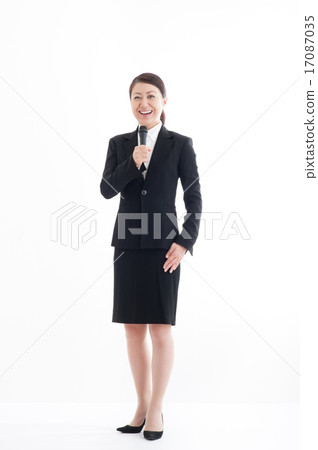 Full body pose of a woman holding a microphone 17087035