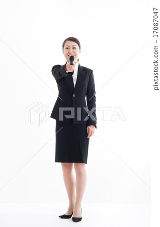 Full body pose of a woman holding a microphone 17087047
