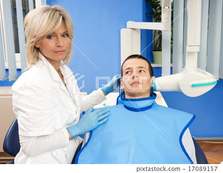 woman dentist with male patient woman dentist with male patient 17089157