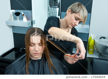 hair stylist working on haircut hair stylist working on haircut 17089844