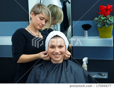 hair stylist drying woman hair hair stylist drying woman hair 17089877
