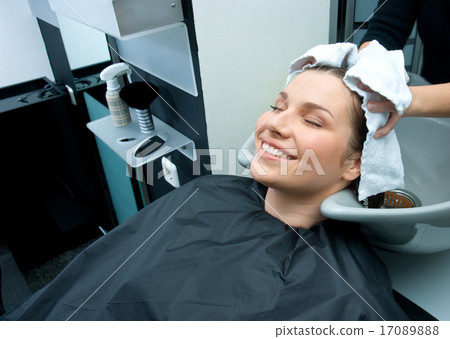 woman drying hair with towel woman drying hair with towel 17089888