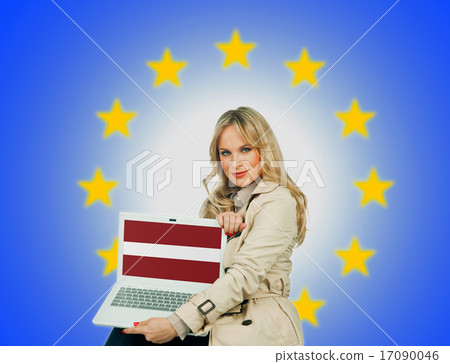 woman holding laptop with latvian flag woman holding laptop with latvian flag 17090046