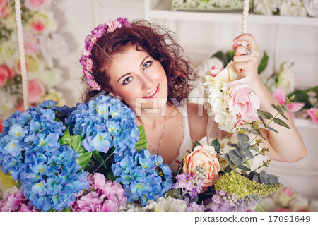 Attractive girl with flowers. 17091649