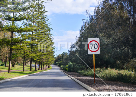 Speed 70 limit sign on a road 17091965