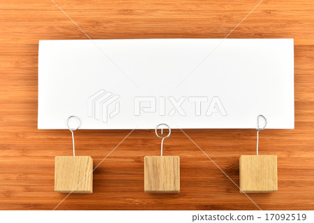 One paper note three holders on wood background 17092519
