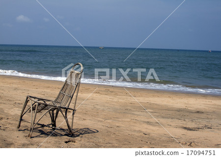 The lonely wattled chair costs on a beach 17094751