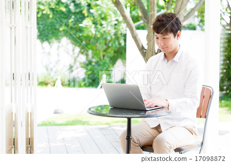 A man who relaxes at a cafe A man who relaxes at a cafe 17098872