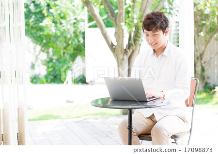 A man who relaxes at a cafe A man who relaxes at a cafe 17098873
