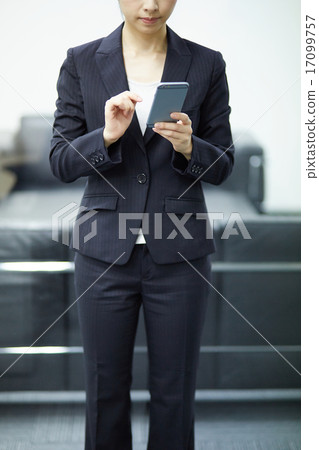 Business woman using a smartphone 17099757
