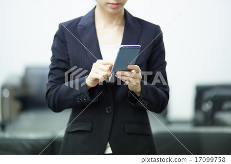 Business woman using a smartphone 17099758