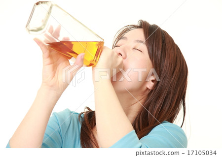 A woman who drinks a trumpet A woman who drinks a trumpet 17105034