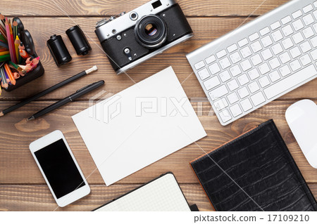 Office desk with supplies, camera and blank card Office desk with supplies, camera and blank card 17109210