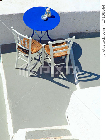 Blue table and chairs on terrace,Santorini, Greece Blue table and chairs on terrace,Santorini, Greece 17109964