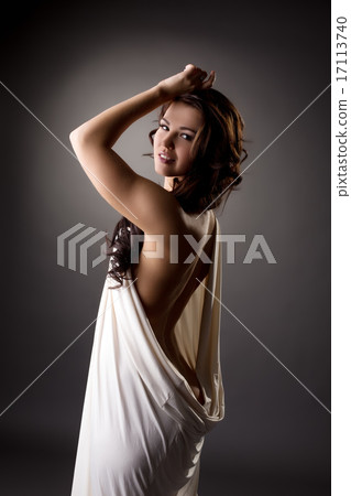 Lovely model posing in loose-fitting dress 17113740