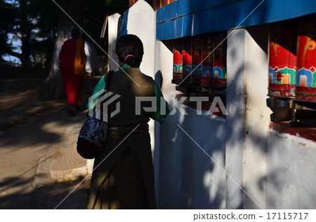 Holy land of Indian Buddhism Dharamsala Man pilgrims turning a car 17115717