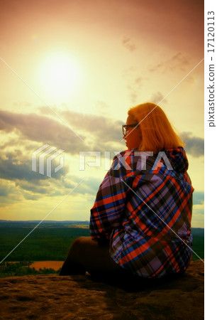 Young blond hair Woman hiker takes a rest Young blond hair Woman hiker takes a rest 17120113