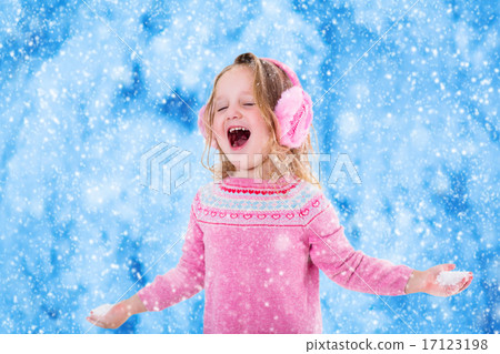 Little girl catching snow flakes 17123198