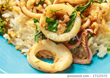 squids fried with chilli pepper and sweet basil on rice 17125572