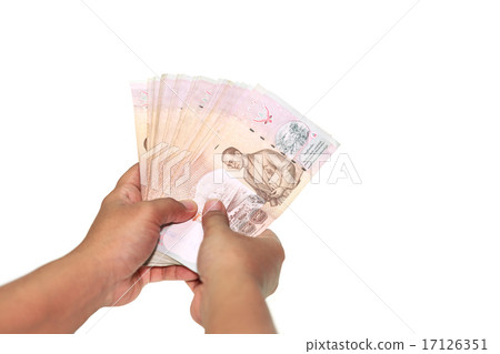 Close up hands holding Thai money isolated on white 17126351