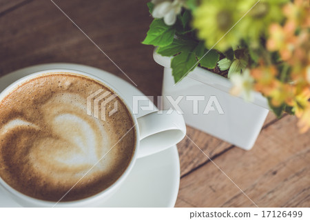 White coffee cup on the table at morning time White coffee cup on the table at morning time 17126499