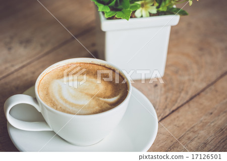 White coffee cup on the table at morning time White coffee cup on the table at morning time 17126501