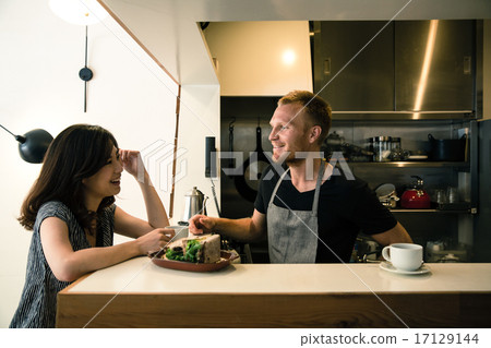 Cafe clerk and customers 17129144