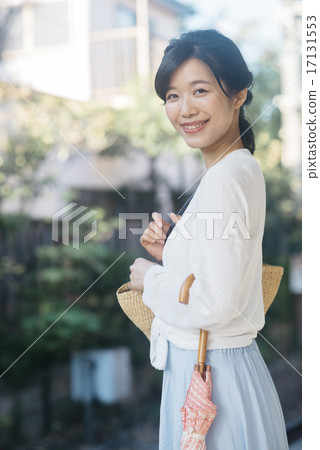 A woman waiting for a train A woman waiting for a train 17131553
