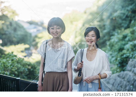 Two women climbing the stairs Two women climbing the stairs 17131574