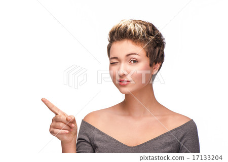 Young woman winking at camera Young woman winking at camera 17133204